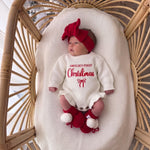 Personalized Name First Christmas Ruffle Romper – Script Embroidered Knit with Frill Trim